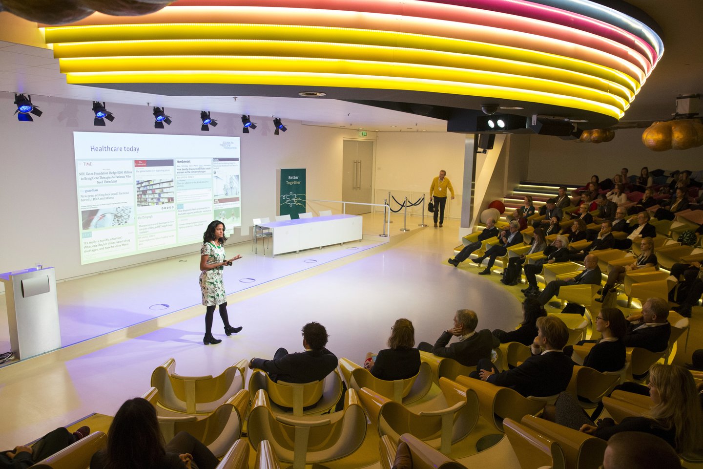 Woman on stage with audience