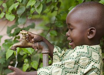 Boy playing with water